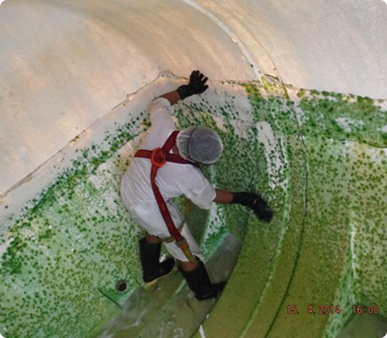 Man cleaning water tank