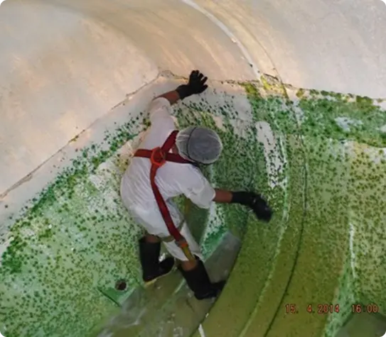 Man cleaning water tank